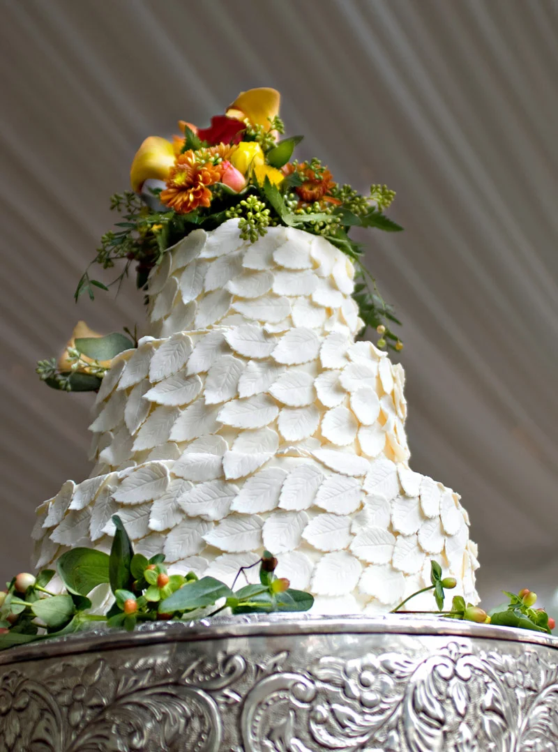 3 tier wedding cake with white leaves